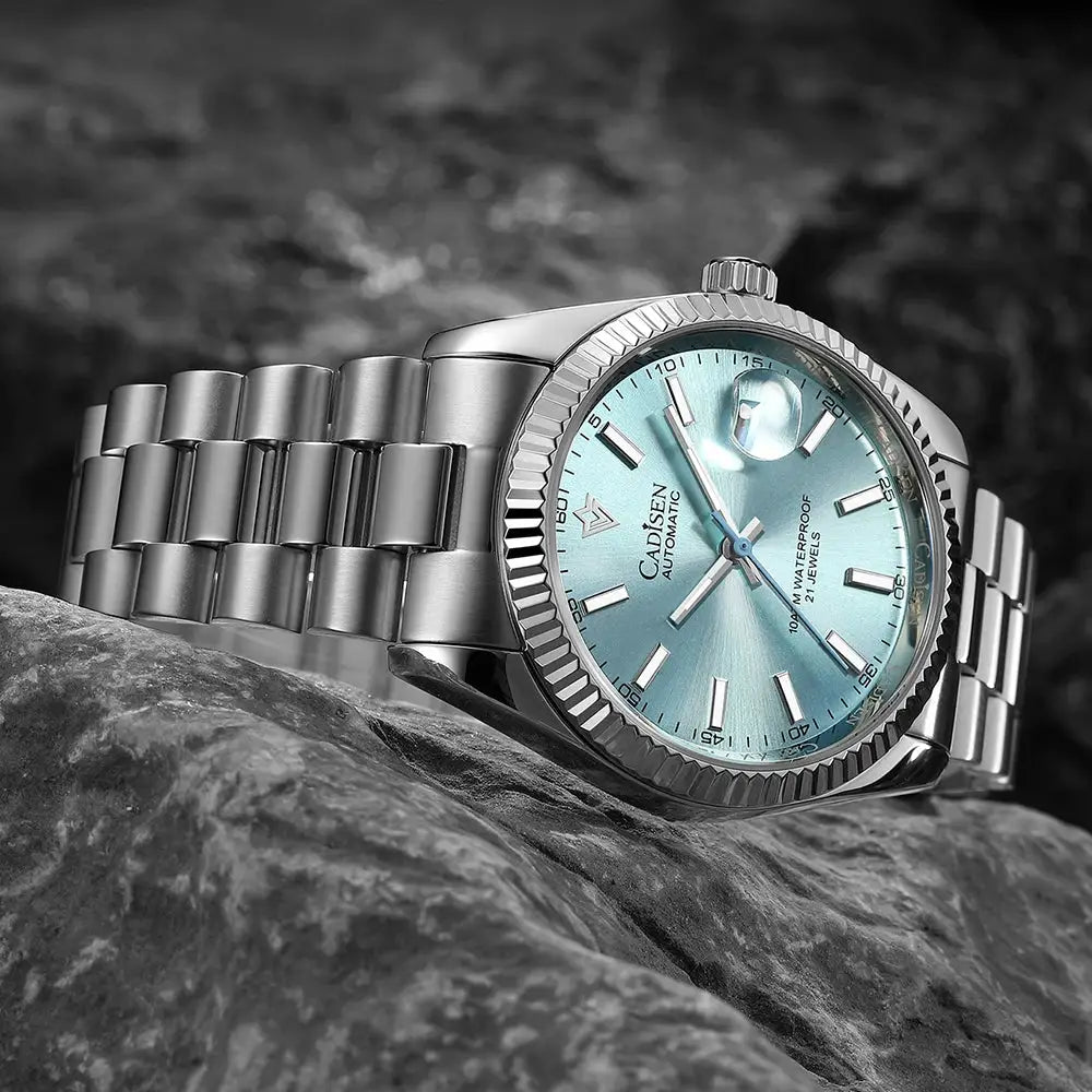 CADISEN men's automatic watch with blue dial, stainless steel bracelet, and date magnifier
