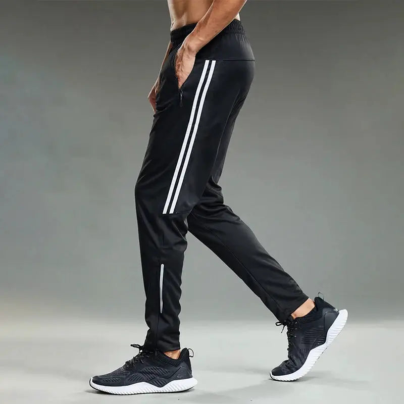 Men's black jogging sport pants with white side stripes and zip pockets