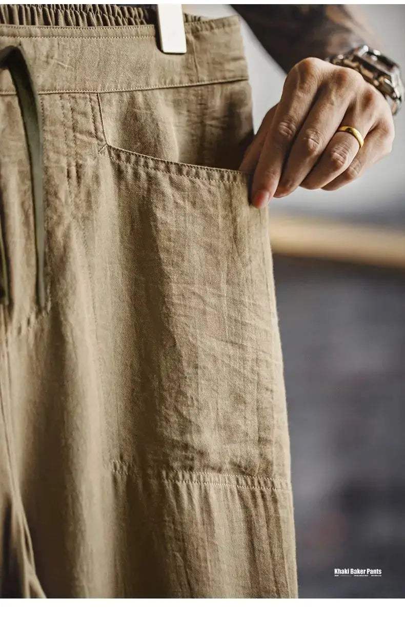 Maden men's linen-blend chinos with elastic waistband in khaki, front pocket detail.