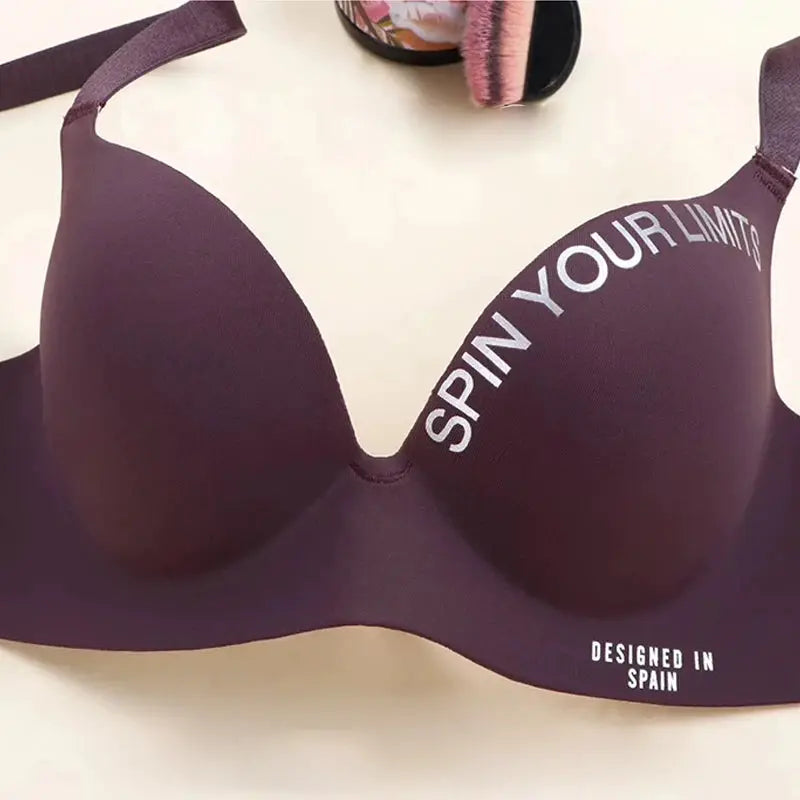 Simplicity letters printed bra in deep purple, seamless cup bralette with SPIN YOUR LIMITS slogan.