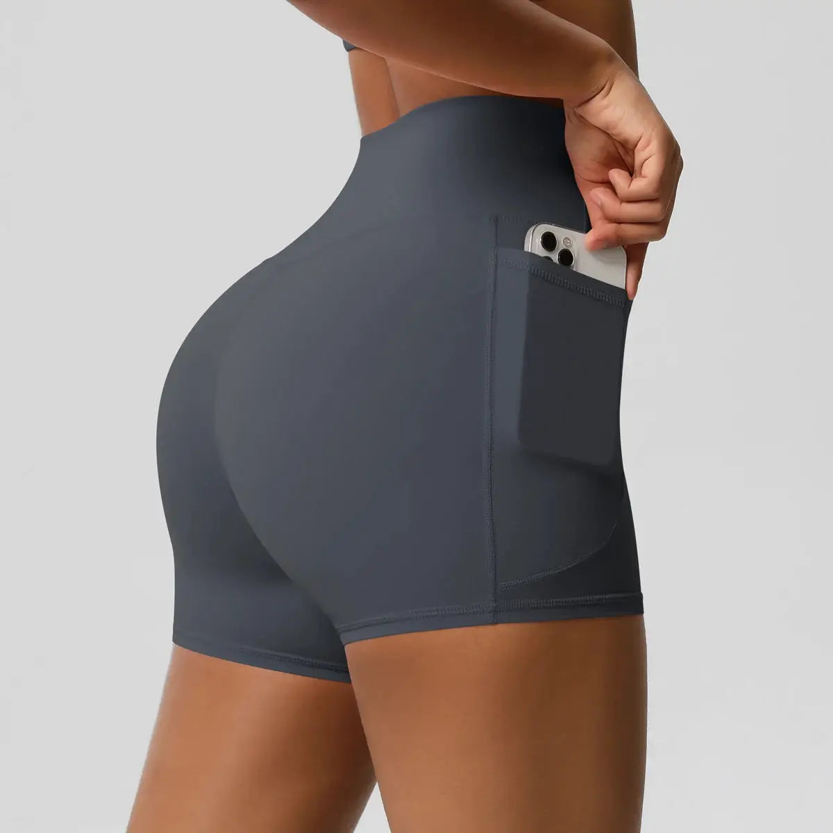 Women’s pocketed yoga shorts by Simples Market, dark gray high-waist athletic shorts with a side phone pocket
