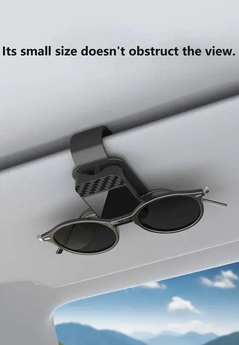 Car sun-visor sunglasses clip with storage; two items: black clip and round silver-frame sunglasses attached