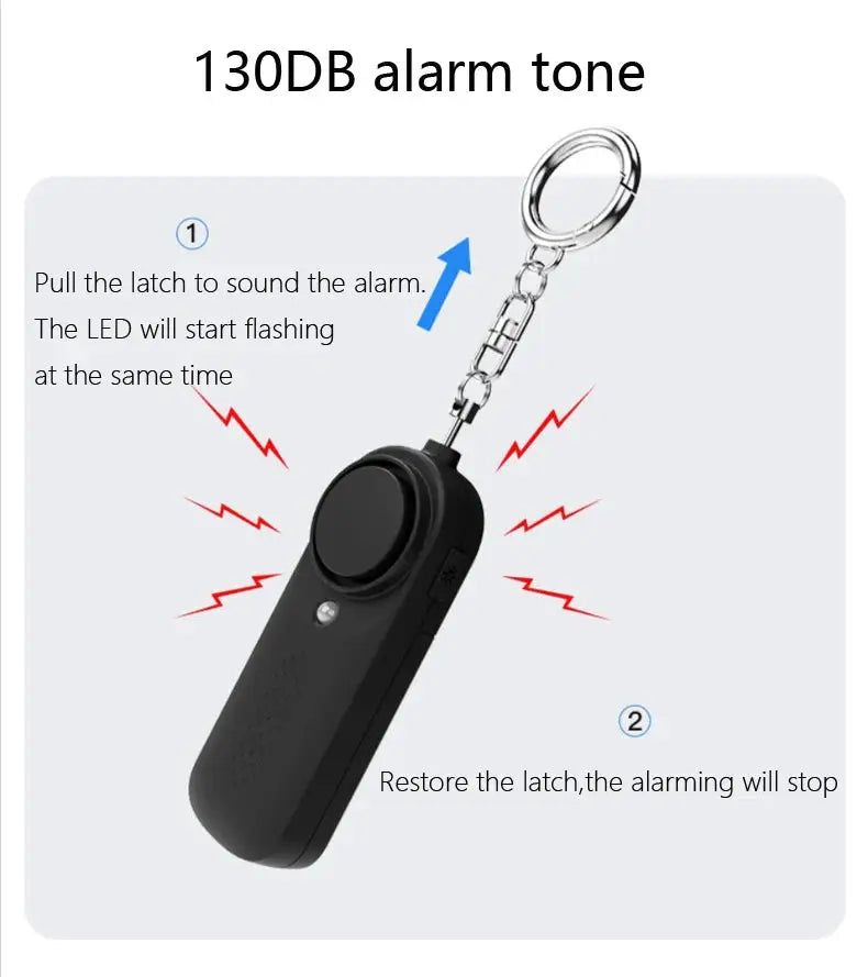 Simples Market 130dB personal defense alarm on keychain; black handheld device with large round button.