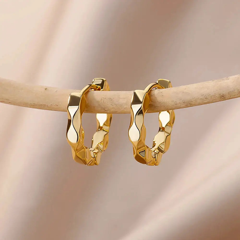 Gold-tone twisted hoop earrings for women with textured faceted round hoops