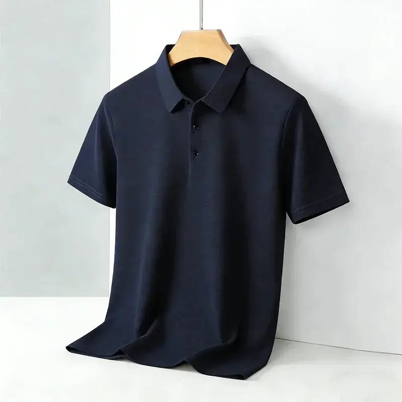 Men's navy polo shirt with classic collar and short sleeves on a hanger
