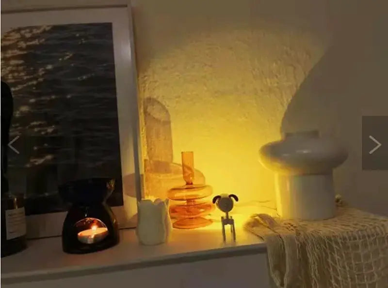 LED mini night light dog/deer foldable desk lamp on white shelf with warm amber glow