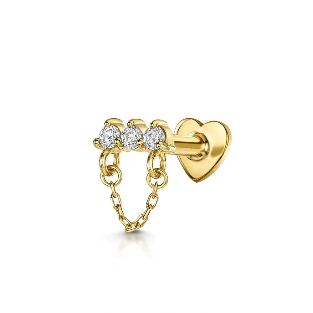 AIDE heart-flat-helix piercing earring by Simples Market in gold-tone with three zircon stones and a dangling chain