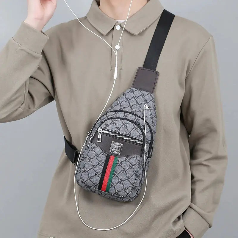 Men's multifunction crossbody messenger bag with gray monogram pattern, black strap, and front zip pocket