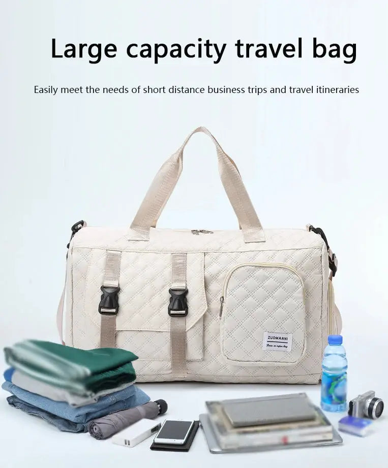 Durable nylon travel duffle bag, cream quilted with top handles and side zip pocket; Zuomanni label.