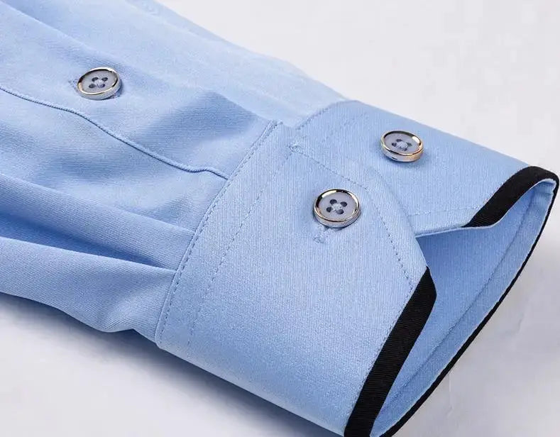 Men's light blue dress shirt cuff with black trim and silver buttons
