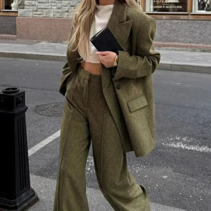 Two-piece olive green blazer and straight pants set for women, casual office look with textured fabric.