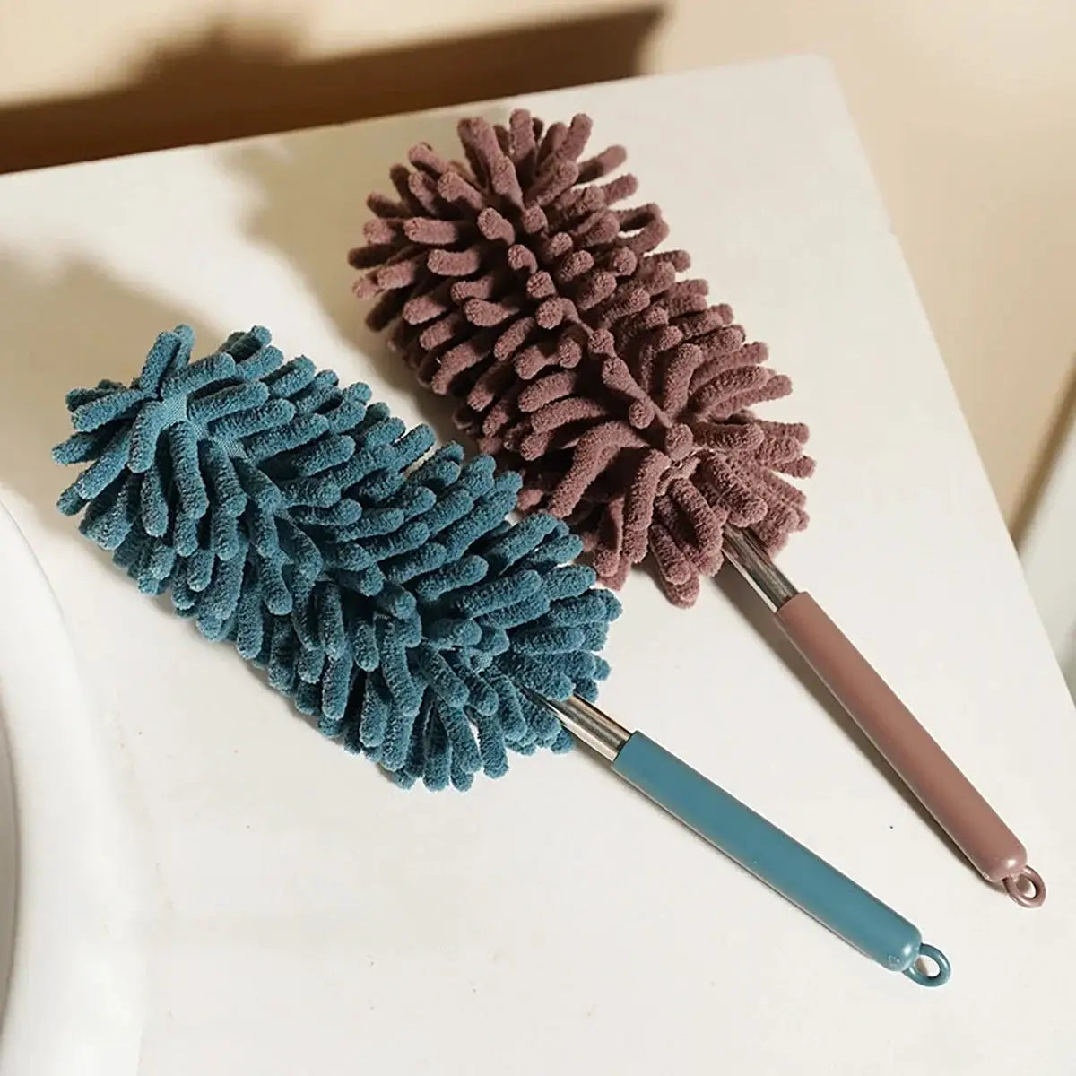 Mini car duster brush set by Simples Market with two extendable bendable microfiber heads in blue and pink
