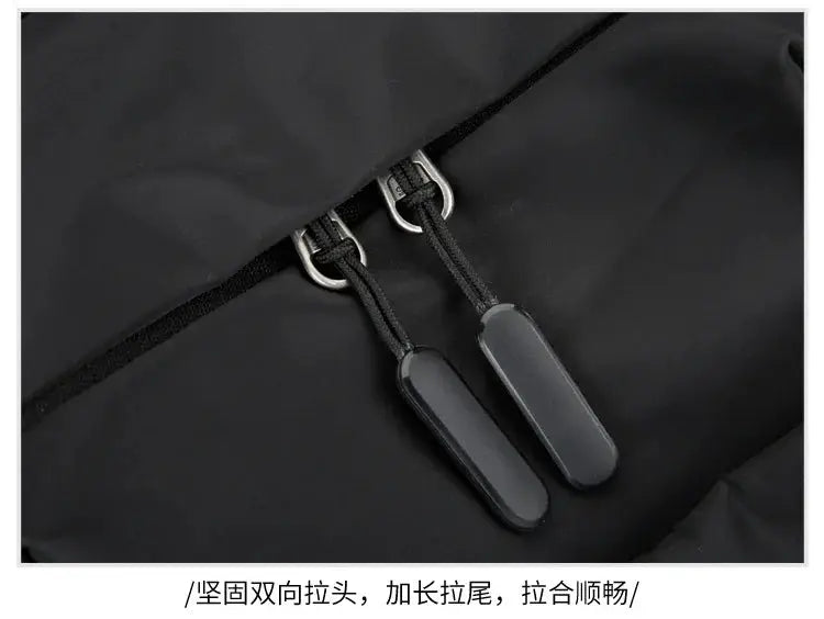 Men's canvas chest bag with dual zipper pulls in black Oxford cloth crossbody sling