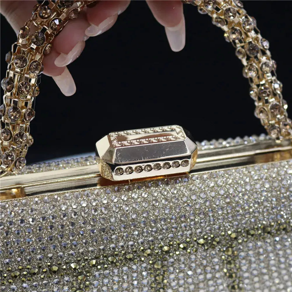 Evening clutch by Simples Market with diamond-design rhinestones and crystal-studded chain handle