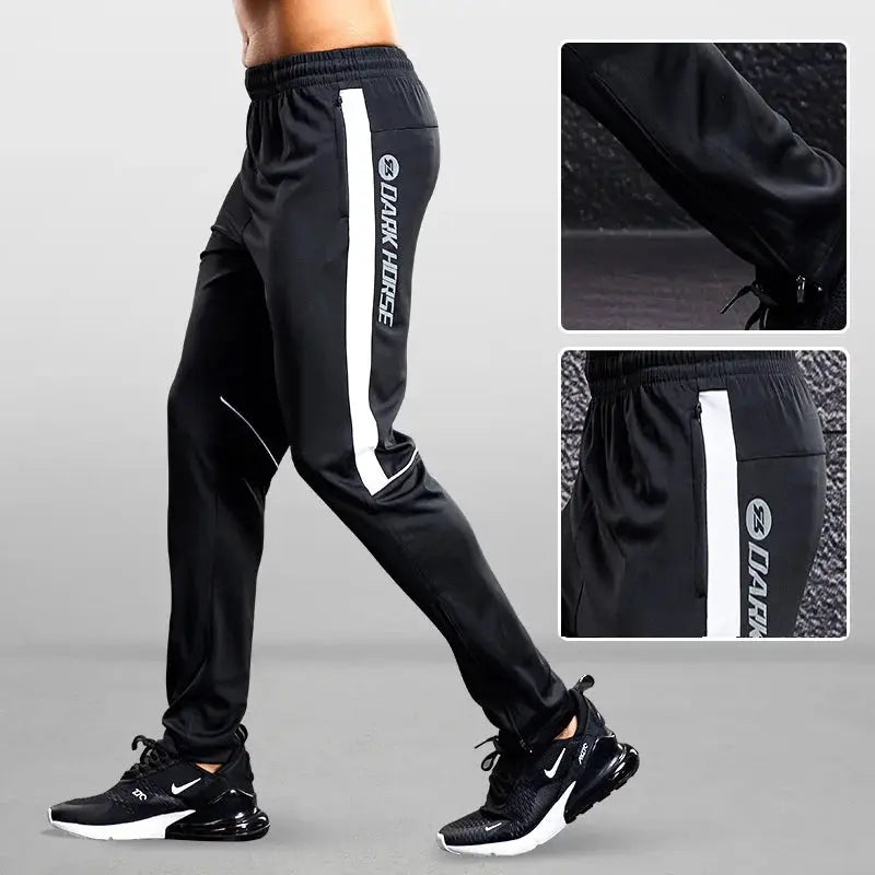 Men's black joggers with white side stripe and zip pocket, Dark Horse branding.