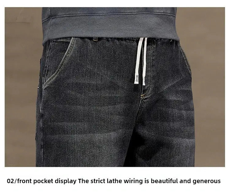 Men's black denim baggy jeans with elastic drawstring waist and front pockets