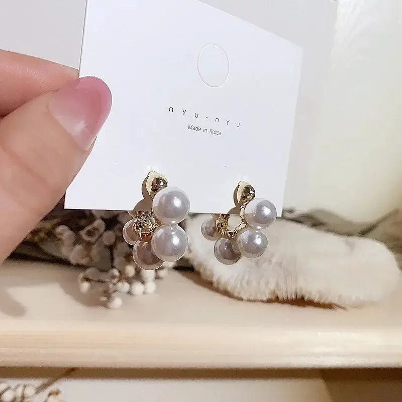 Gold color imitation pearl C-shape drop earrings with pearl cluster by Simples Market