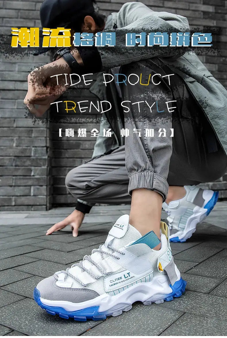 Pair of men's running sneakers with white and grey upper and blue chunky sole