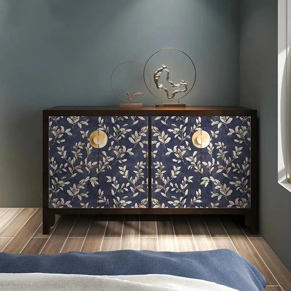 Floral grey peel-and-stick wallpaper on cabinet doors; navy background with pink blossoms, Simples Market.