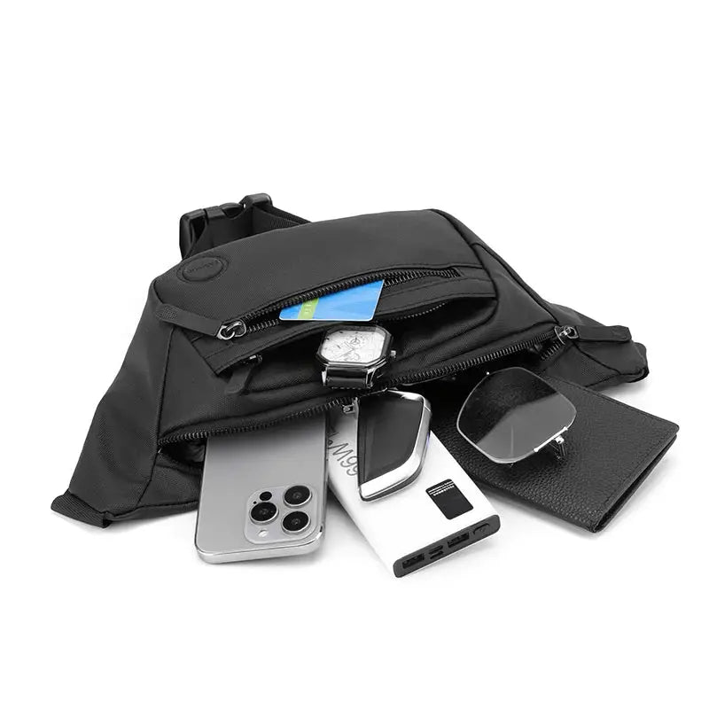 Unisex black waterproof waist bag opened to reveal four items: smartphone, smartwatch, power bank, and wallet.