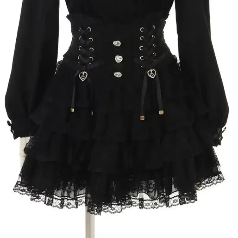 Black Lolita-style blouse with lace-up corset waist, heart charms, and tiered lace hem