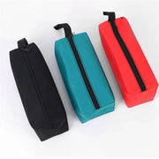 Small Oxford cloth hand-held tool bag set of 3 by Simples Market in black, teal, and red with zippers.