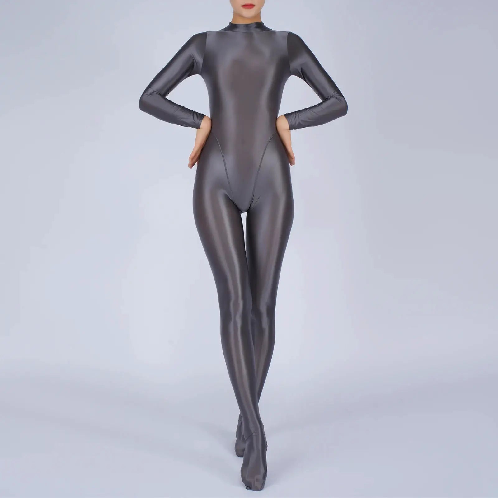 Women's metallic gray full-body jumpsuit with long sleeves and footed design.