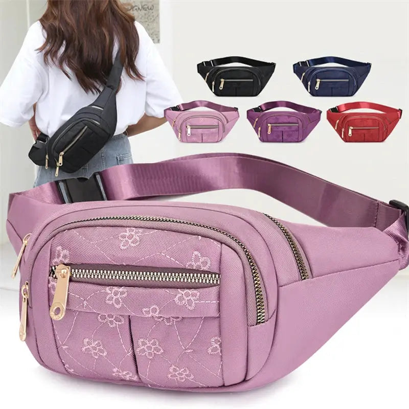 Simples Market waist bag in lavender purple waterproof Oxford cloth with floral embroidery and gold zippers.