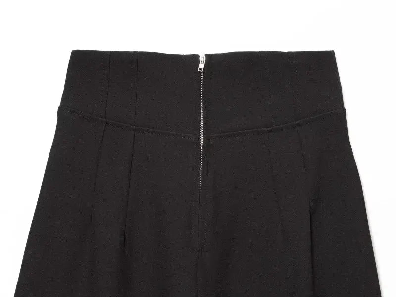 Slim-fit black high-waisted suit trousers with back zipper closure.