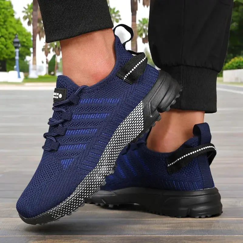 Pair of navy blue Simples Market men's running sneakers with a thick sole and breathable knit upper