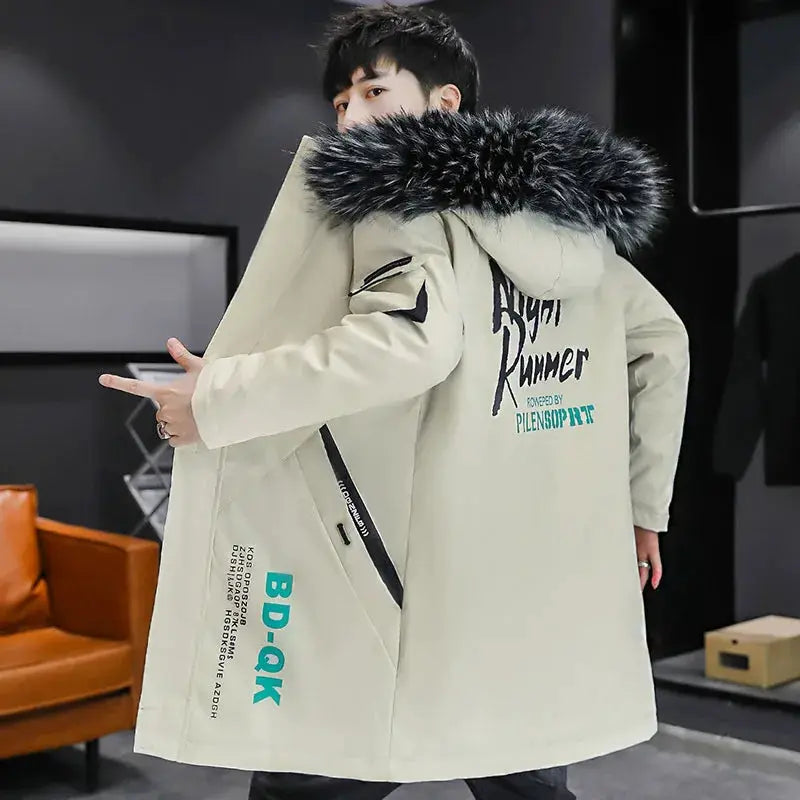 Men's long beige down jacket with black fur-trimmed hood, oversized fit and back graphic design.