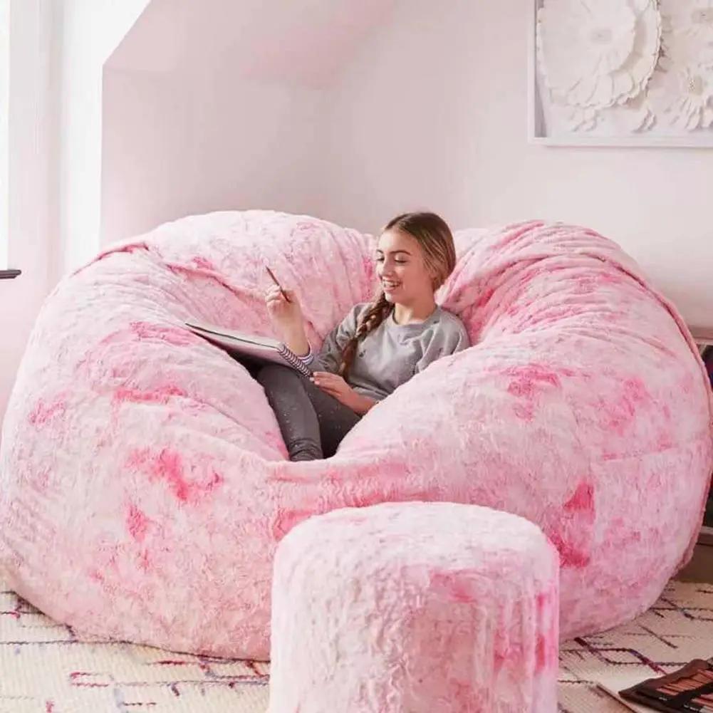 Pink plush giant bean bag sofa bed with matching ottoman for cozy lounge seating