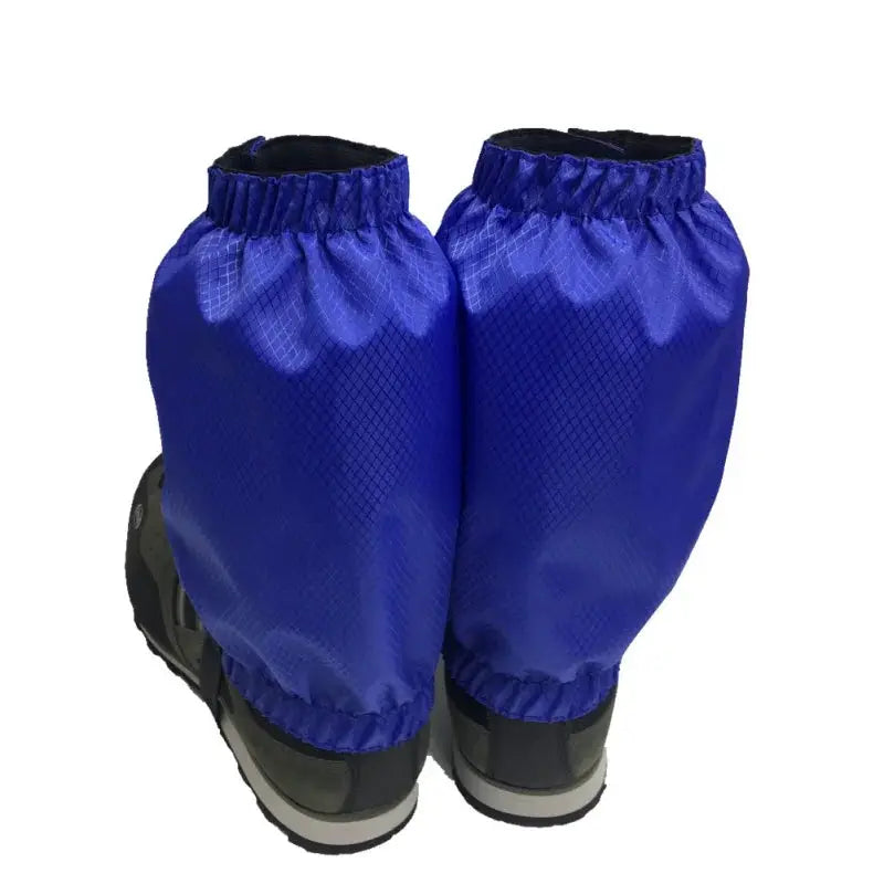 Two blue waterproof legging gaiters for boots; snow gaiters for hiking.
