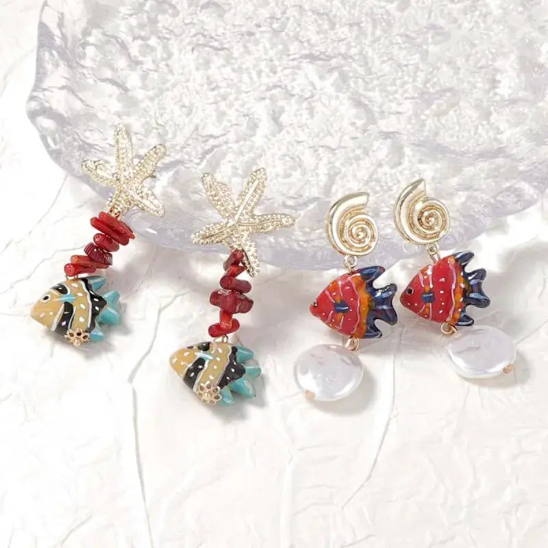 Set of 4 marine-themed earrings with starfish and fish charms, red beads and glass accents, Simples Market