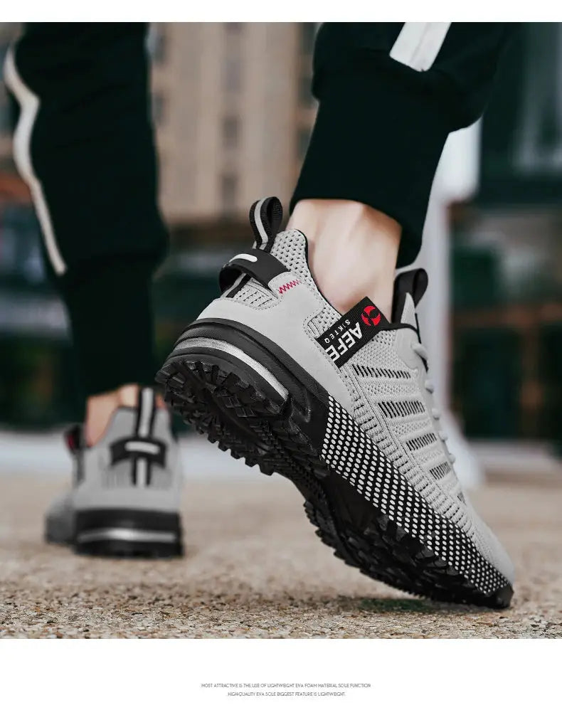 Men's gray breathable running shoes with knit mesh upper and rugged black outsole (pair)