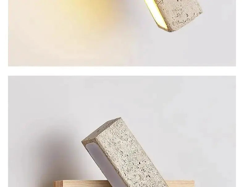 Natural stone wall lamp sconce by Simples Market; beige textured block with warm ambient glow