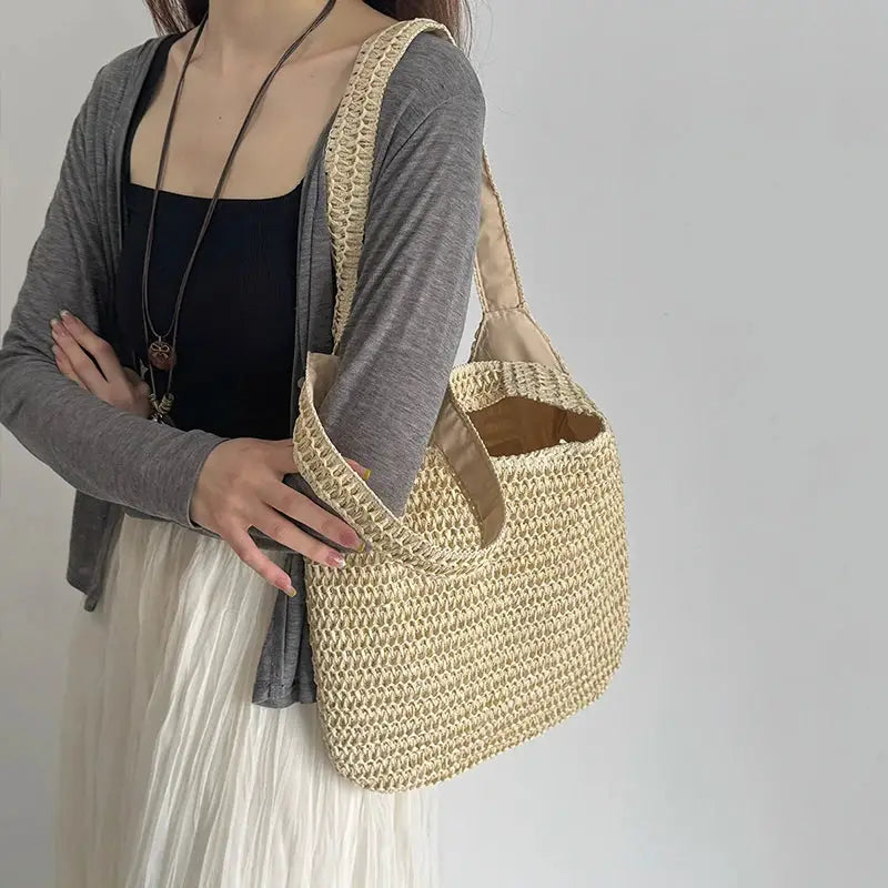 Rattan woven women's shoulder bag natural beige, large capacity beach tote for casual summer outfits.