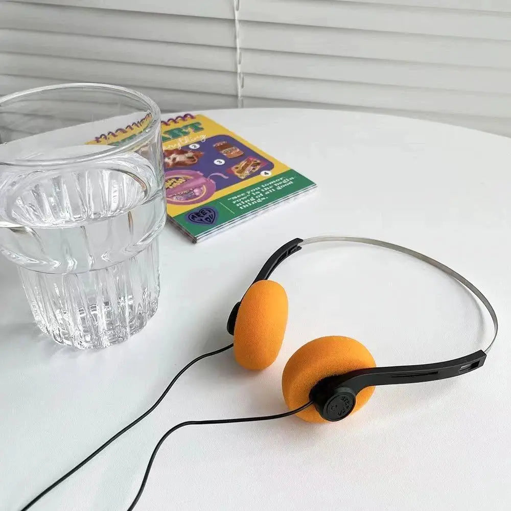 On-ear wired stereo headphones with orange foam pads, retro vintage style, adjustable headband, 3.5mm plug