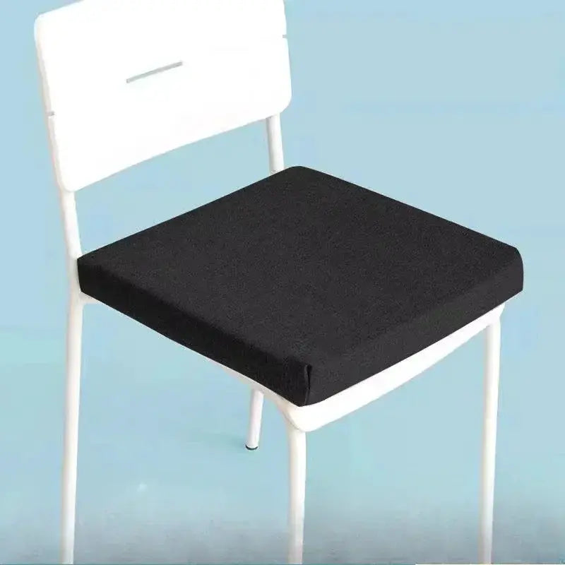 Natural latex chair cushion 50x50 cm, black thick seat pad on a white classroom chair