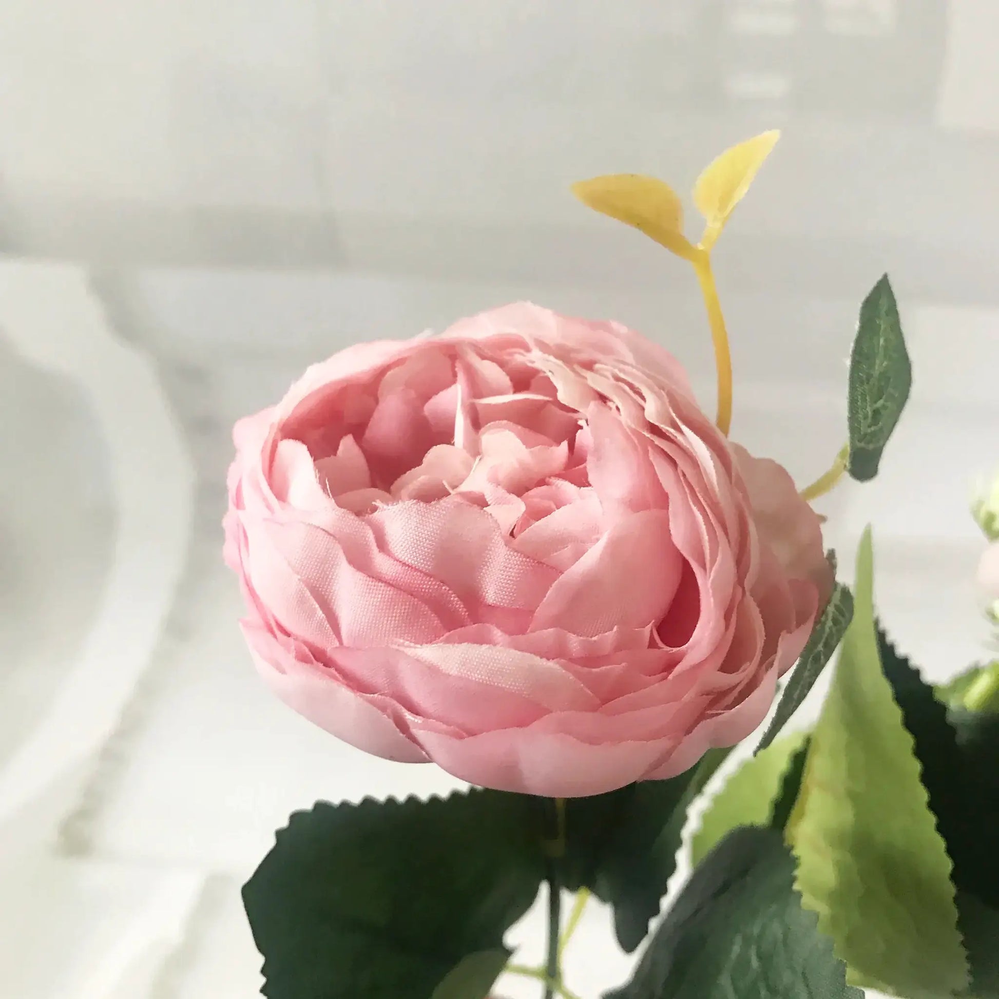 Pink silk peony artificial flower with green leaves and large fabric petals