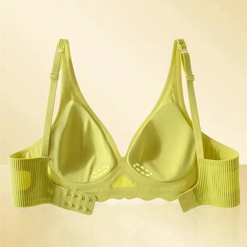 Seamless women's lime green bra by Simples Market with wide striped back band and adjustable straps.