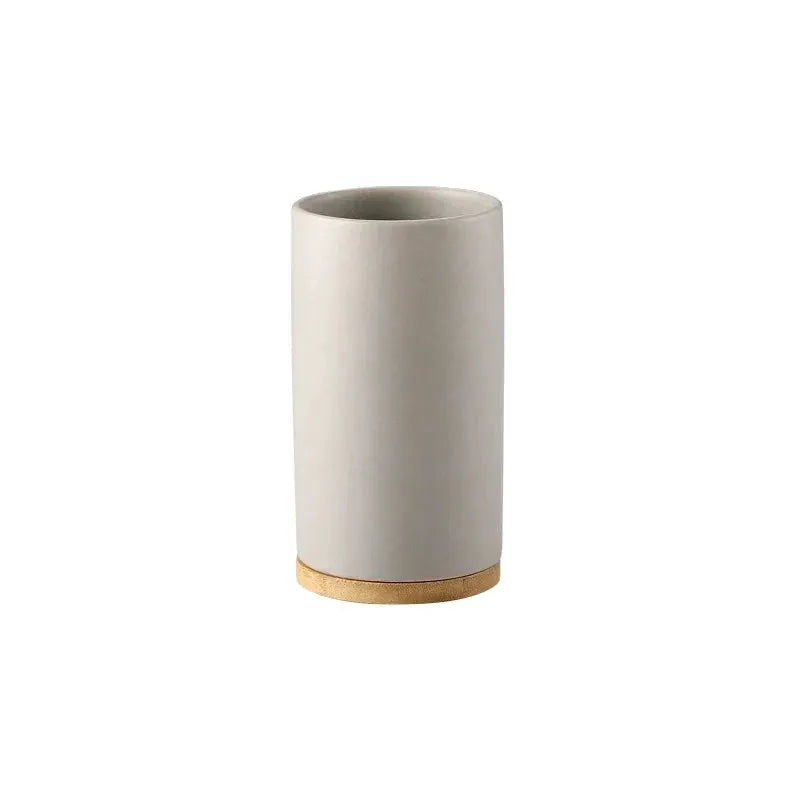 Ceramic bathroom tumbler by Simples Market with cork base, white cylindrical design