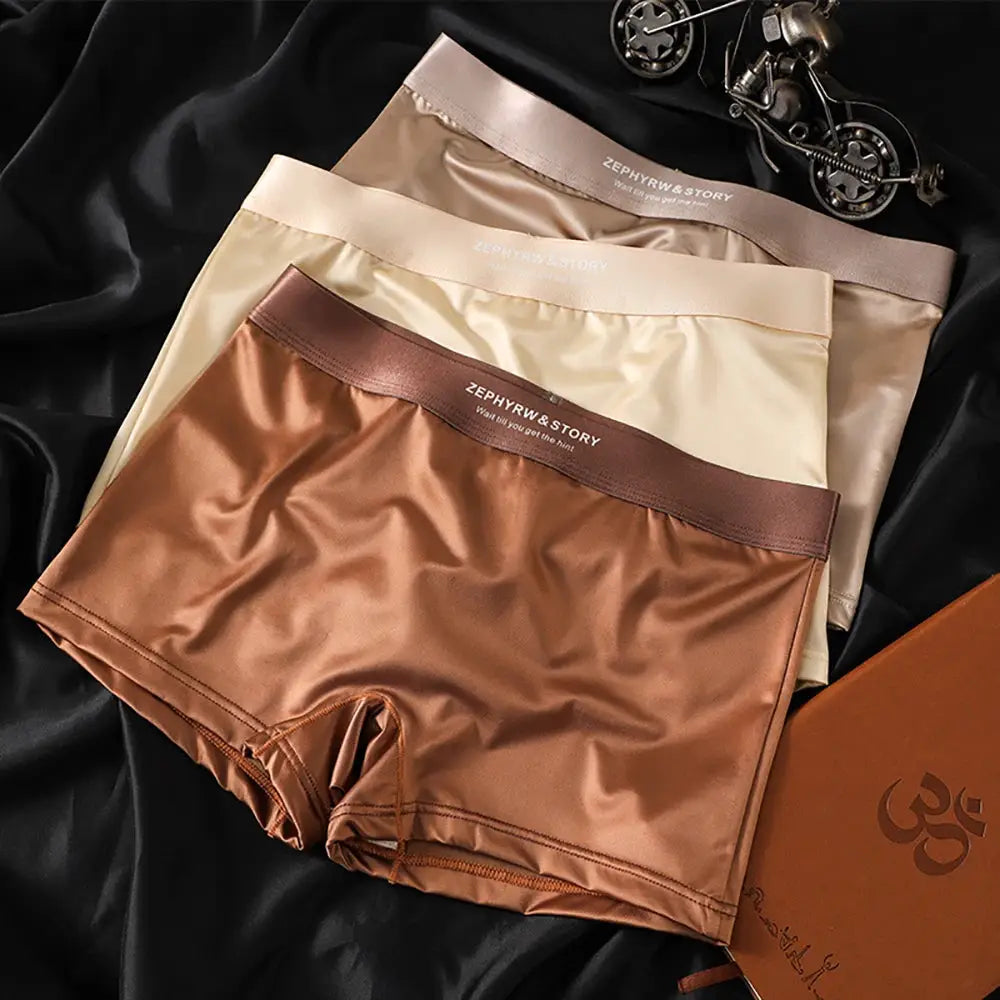 Three-pack luxury ice-silk panties with branded waistband in bronze, beige, and champagne, breathable mesh crotch