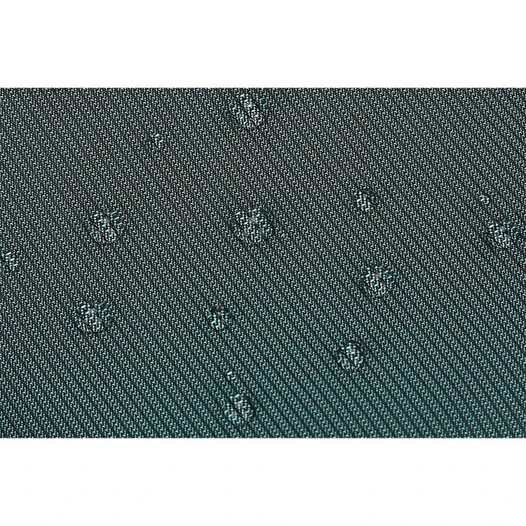 Men's shoulder bag fabric close-up in teal denim-like material with a small repeating pattern.