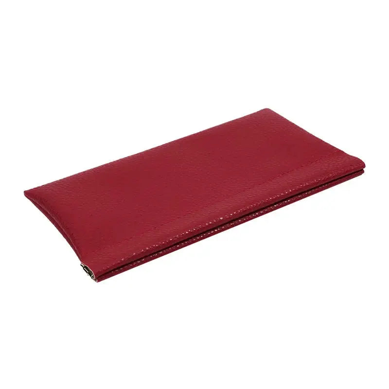 Long red artificial leather wallet with self-closing design for passport and ID holders.