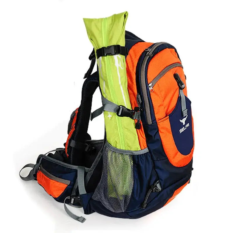 Outdoor walking stick carry bag in lime green attached to an orange and navy trekking backpack, waterproof pole storage