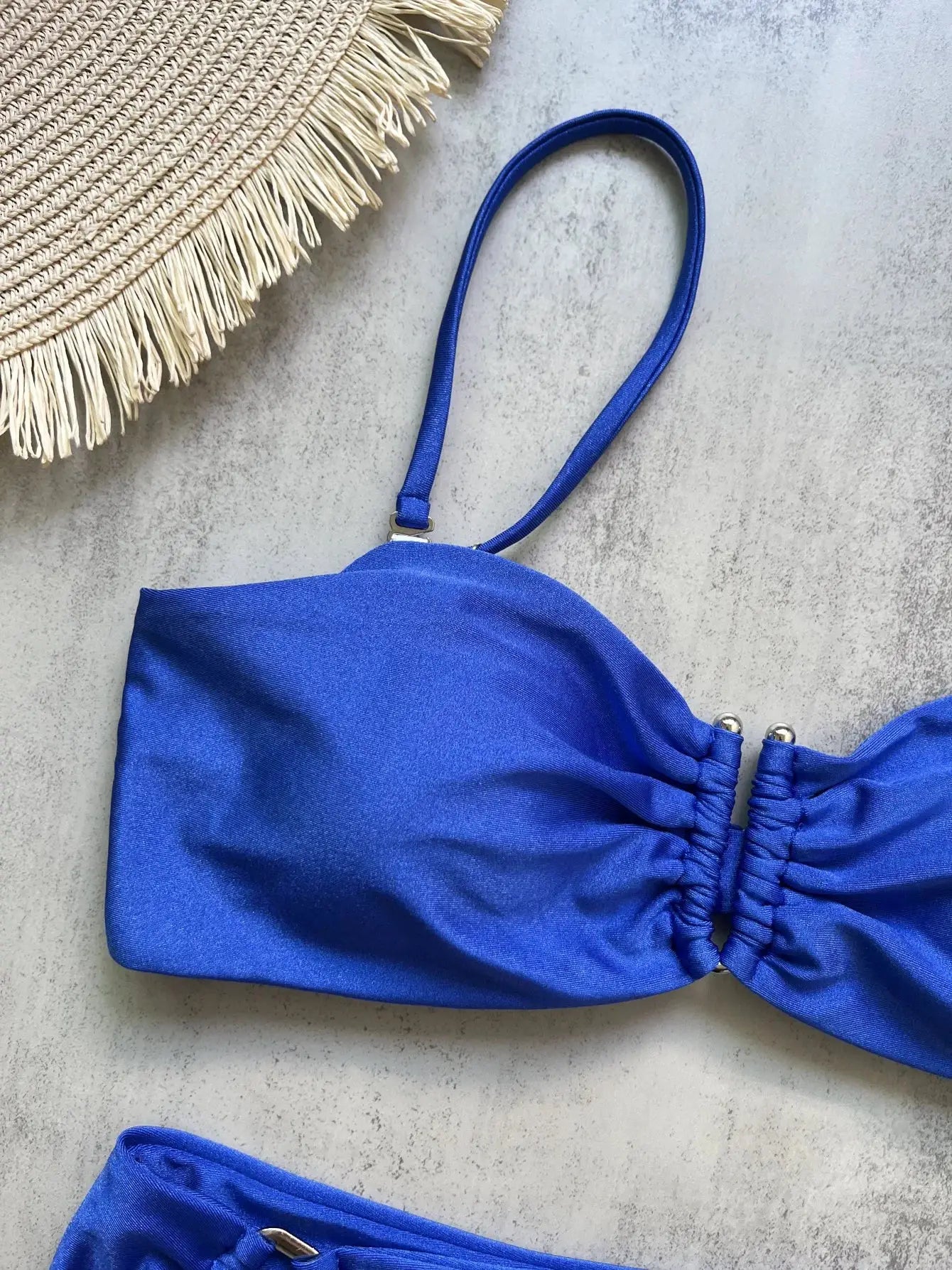 Blue bandeau bikini top with ruched sides and attached strap detail
