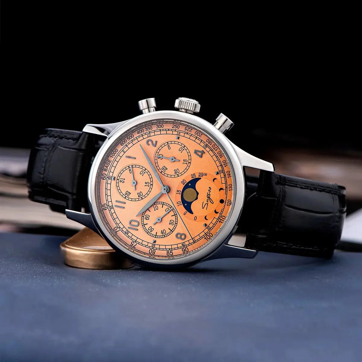 Sugess men's chronograph watch with peach dial, moonphase, stainless steel case, black leather strap