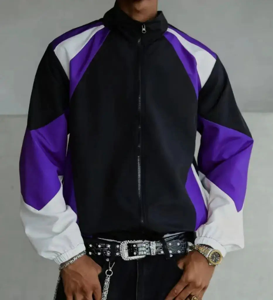 Men's color-blocked lightweight windproof jacket with purple, black and white panels.