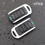 4 in 1 garage remote key fob transmitter by Simples Market, black with white frame, two units shown